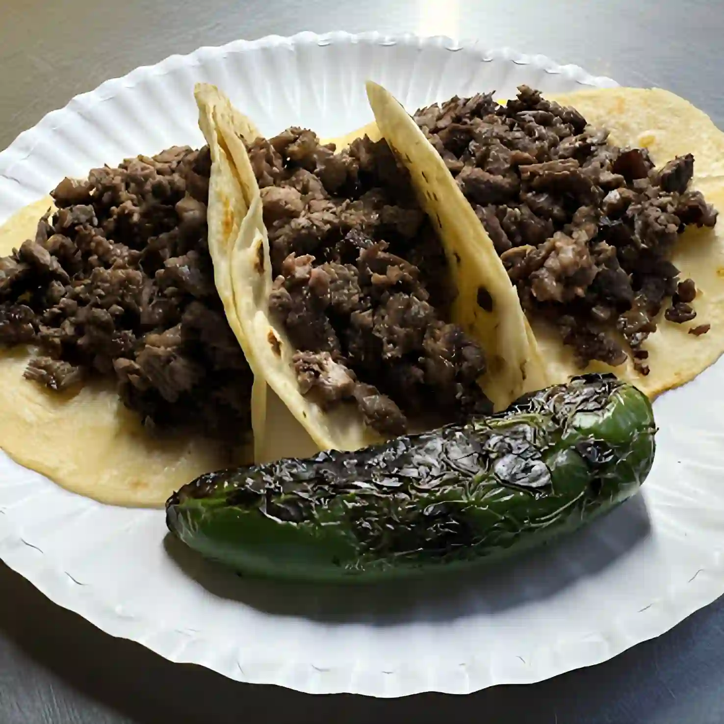 Carne Asada Tacos - Grilled beef with onions, cilantro, lime, and corn tortillas