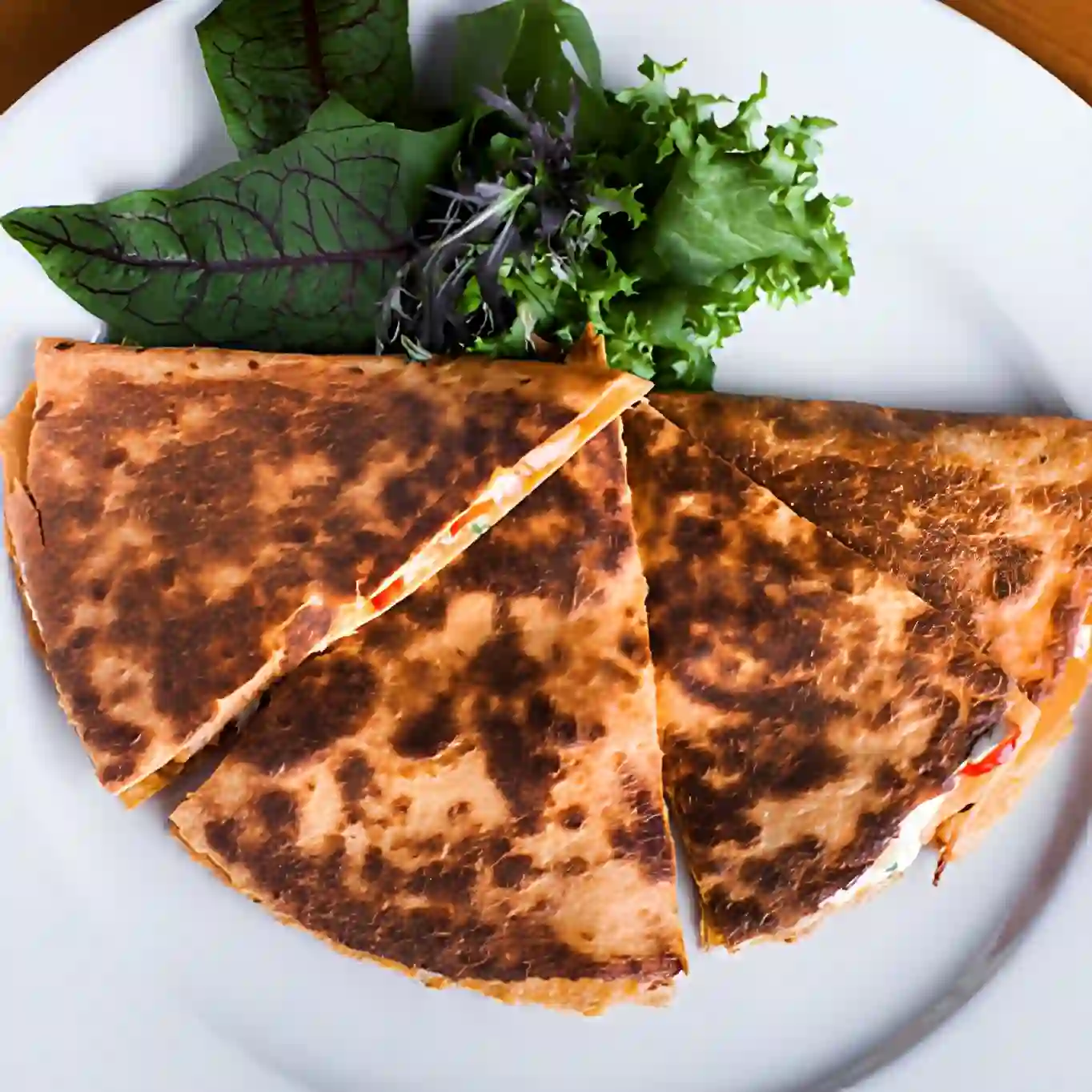 Quesadilla - Toasted tortilla filled with melted cheese and your choice of meat