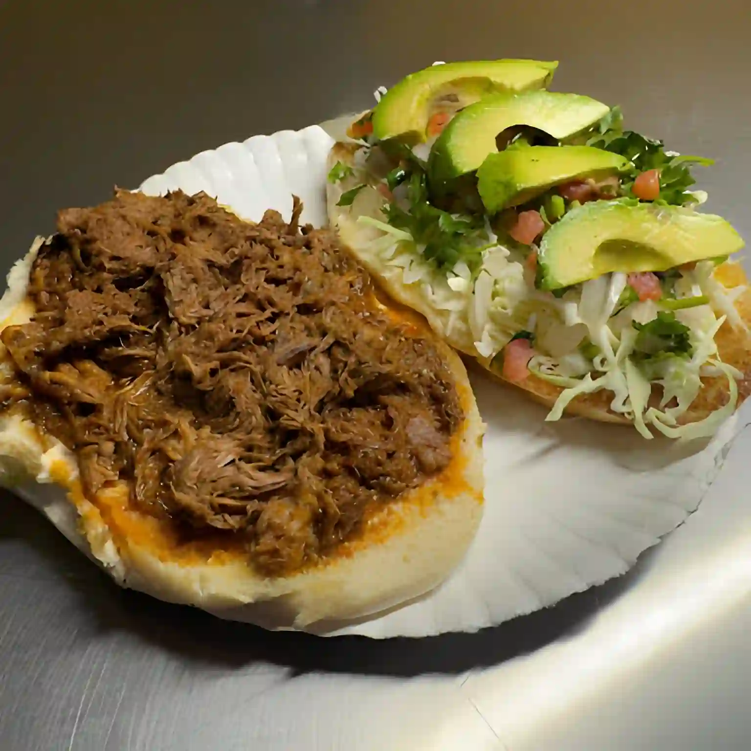 Torta - Soft Mexican roll with grilled meat, cheese, lettuce, and avocado